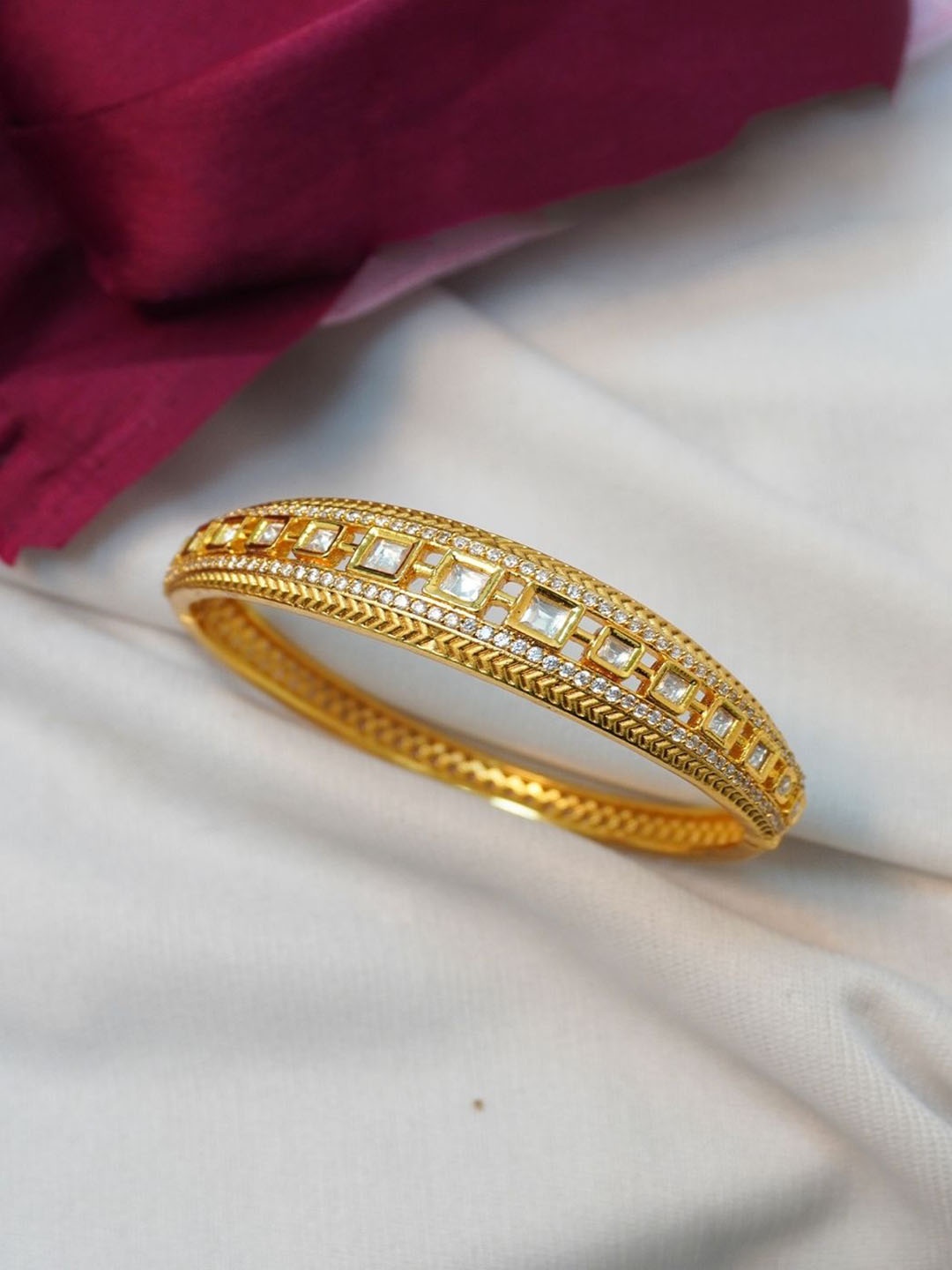 

Niscka Gold Plated American Diamond Studded Bangle Style Bracelet
