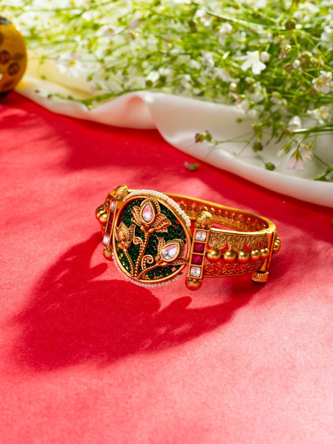 

Niscka Gold Plated Kundan Stone Studded & Beaded Bangle Style Bracelet
