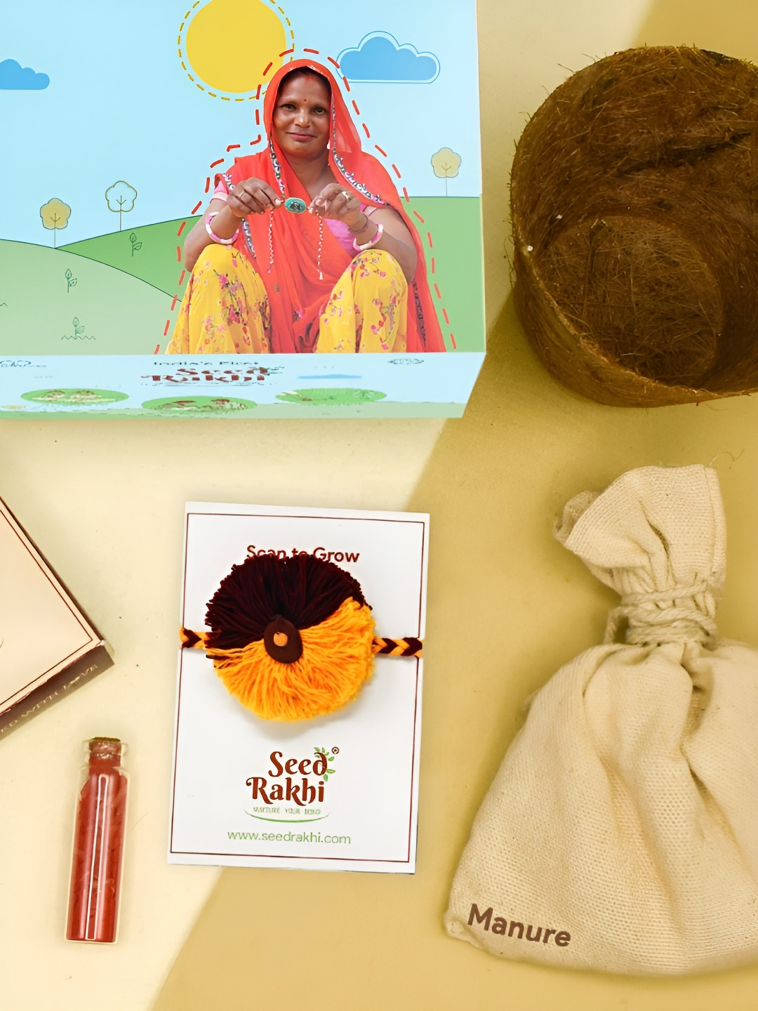 

Indigifts Seed Eco Friendly Rakhi With Fishtail Braiding & Pom Pom Gift Set, Yellow