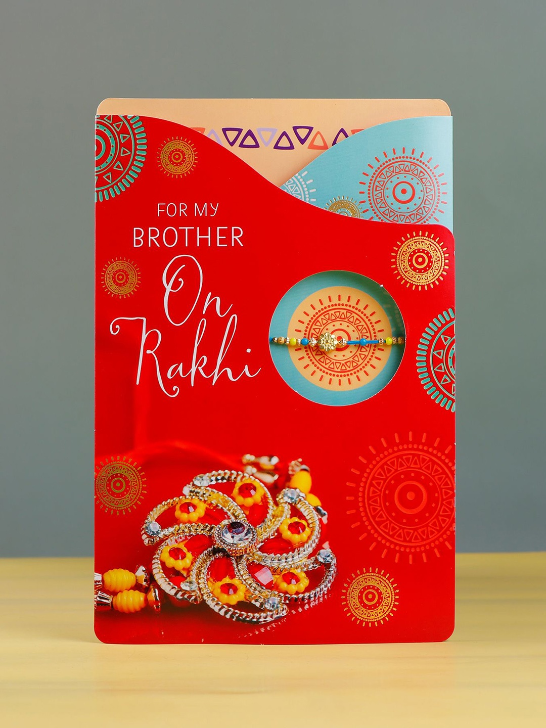 

Archies Beaded Rakhi With Greeting Card & Roli Chawal, Blue