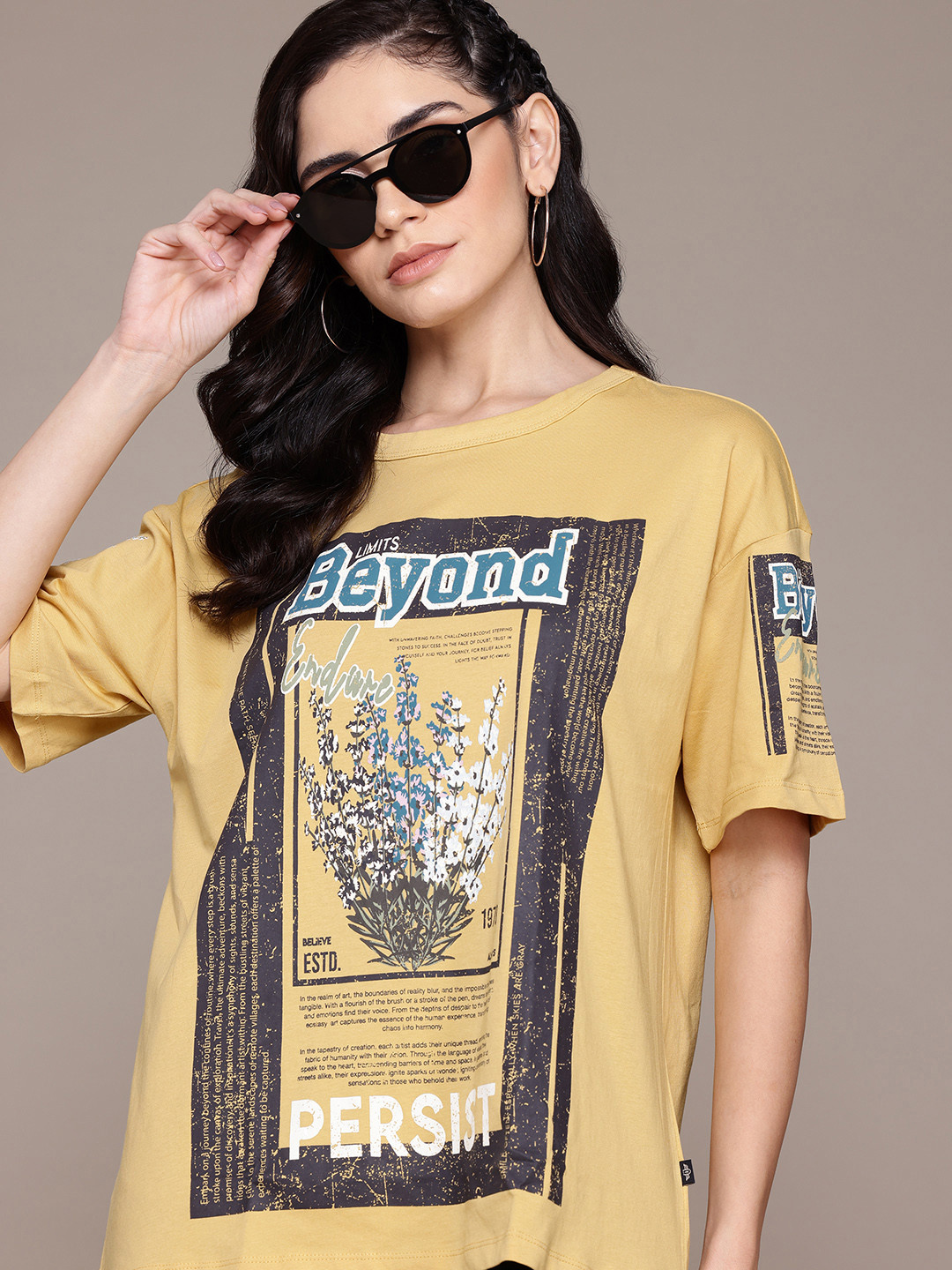

Roadster Pure Cotton Graphic & Typography Printed Drop-Shoulder Sleeves T-shirt, Mustard