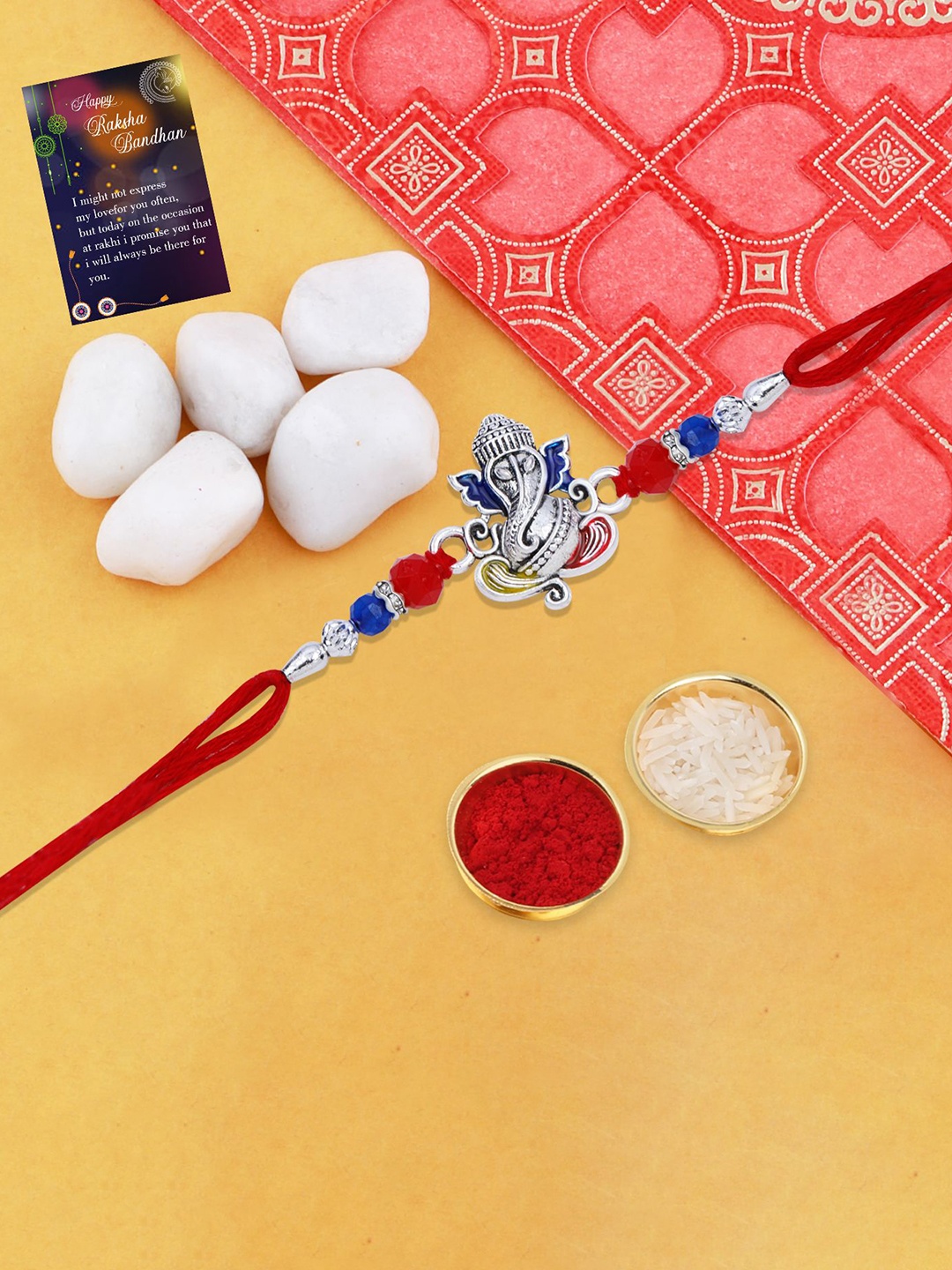 

Silver Shine Set of 2 Lord Ganesh Rakhi With With Roli Chawal Greeting Card & Pooja Thali, Red