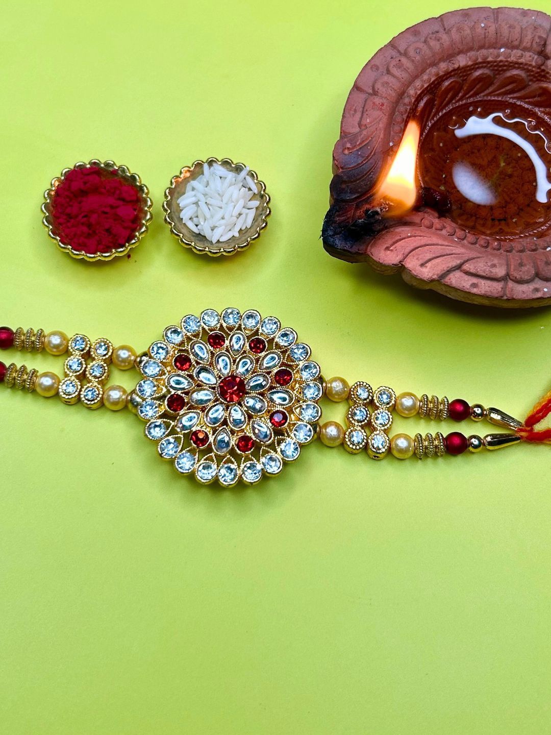

LAIDA Sugreev Kundan Studded Floral Thread Rakhi With Roli & Chawal, Gold