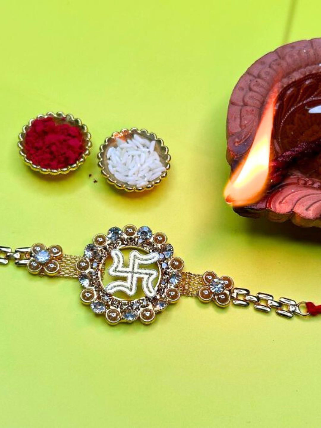 

LAIDA Swastik Rhinestone Studded & Beaded Thread Rakhi With Roli Chawal, Gold