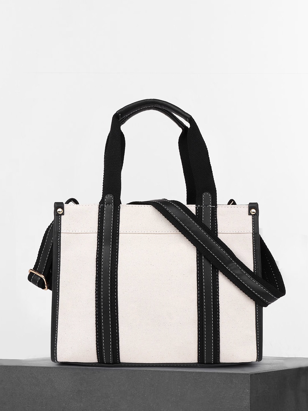 

Womanix Women's Colourblocked Structured Handheld Bag with Tasselled, Beige
