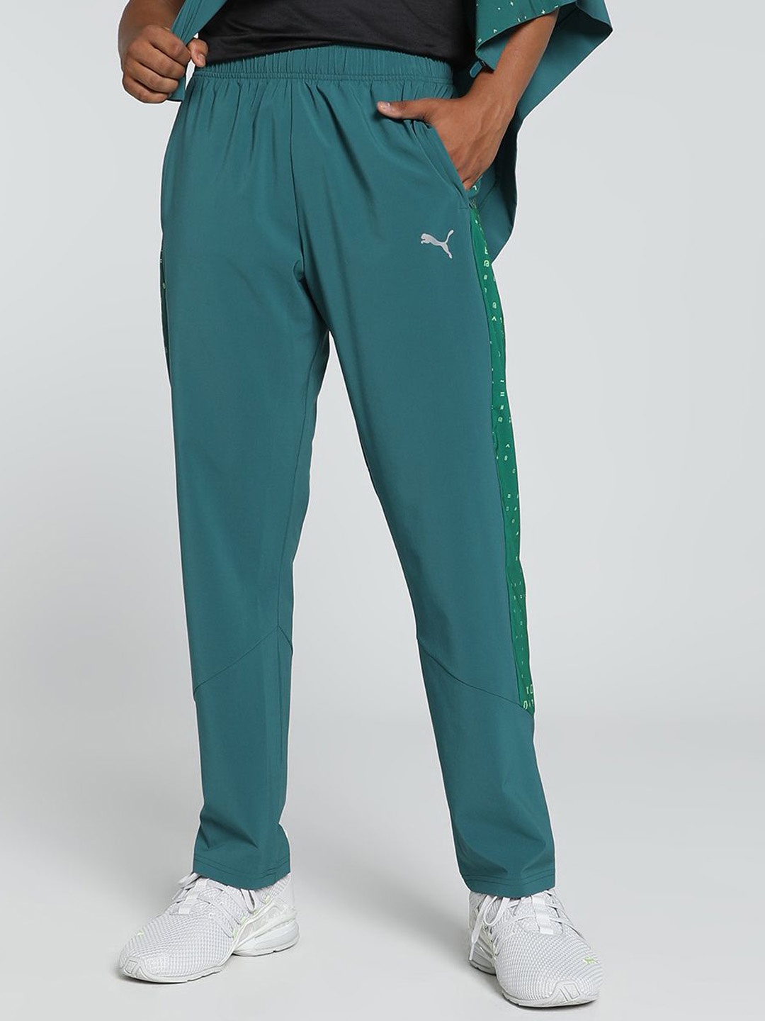 

one8 x PUMA Men Solid Mid Rise Slim Fit Regular Track Pants, Green
