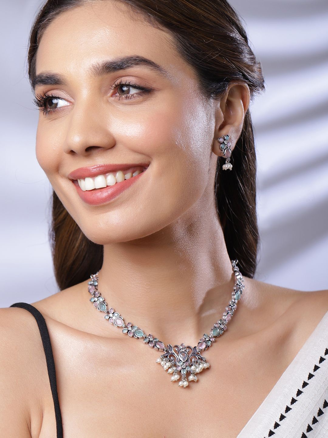 

Rubans Oxidized Silver-Plated Pink & Turquoise Blue Stone Pearl Beads Floral Jewellery Set