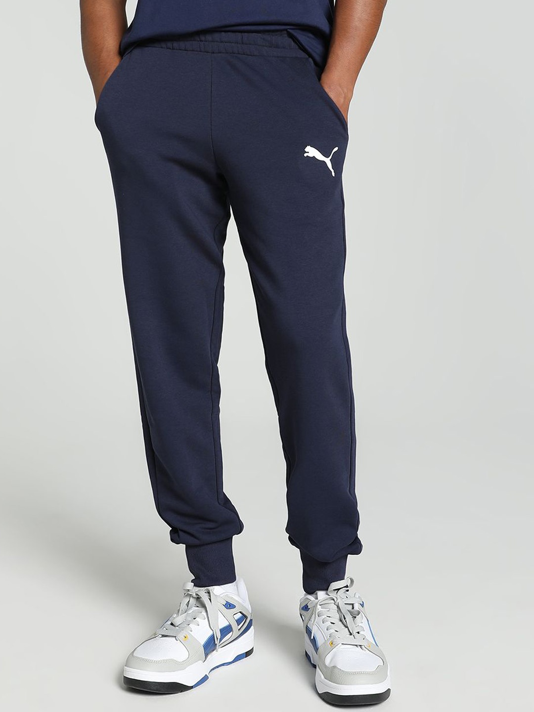 

Puma Men's Solid Brand Logo Cotton Regular fit RegularTrack Pants, Blue