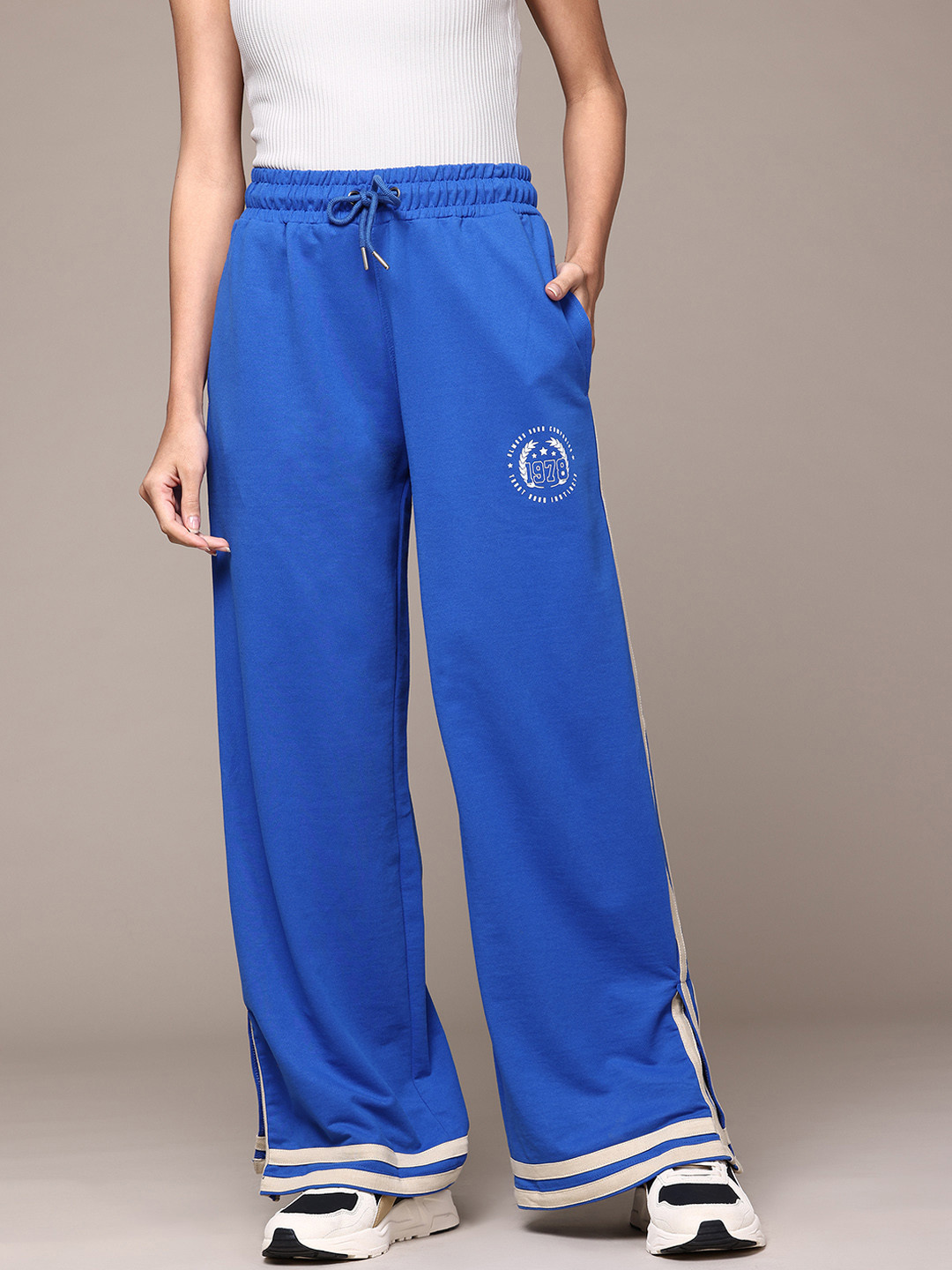 

The Roadster Lifestyle Co. Women Side Striped Flared Track Pants, Blue