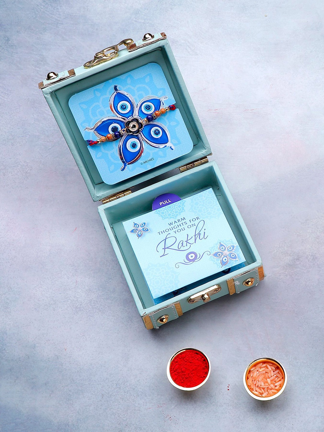

Archies Evil Eye Beaded Rakhi in Trunk Box With Roli Chawal & Greeting Card, Green