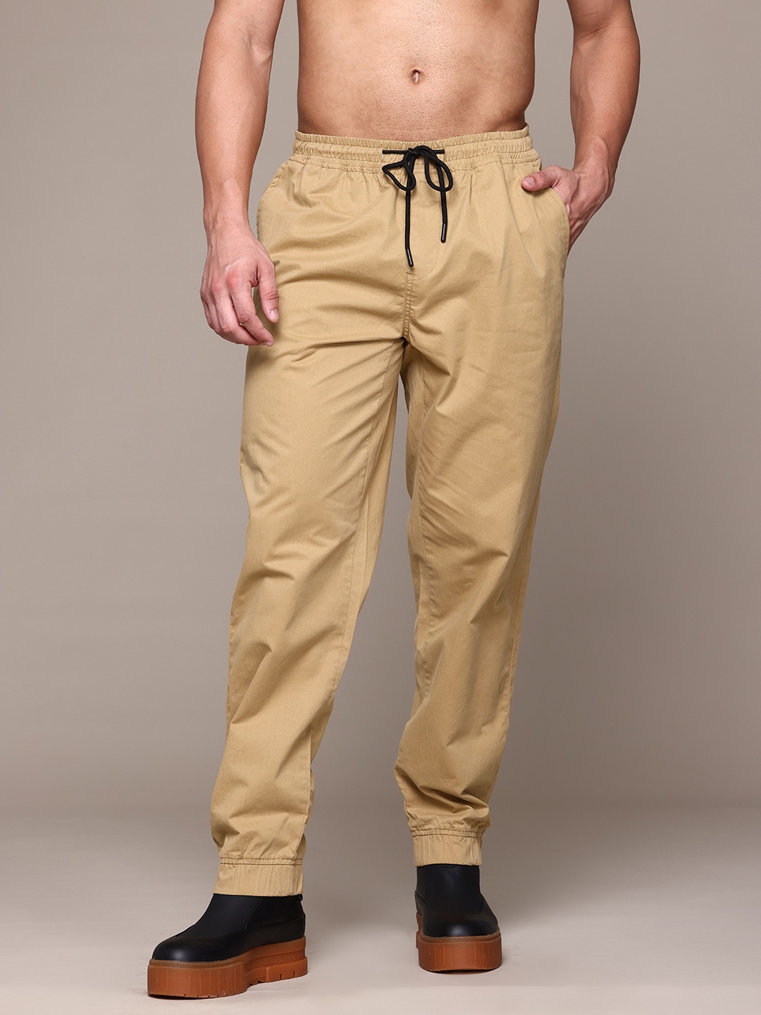 

Roadster The Lifestyle Co. Men Cotton Relaxed Fit Joggers, Camel brown