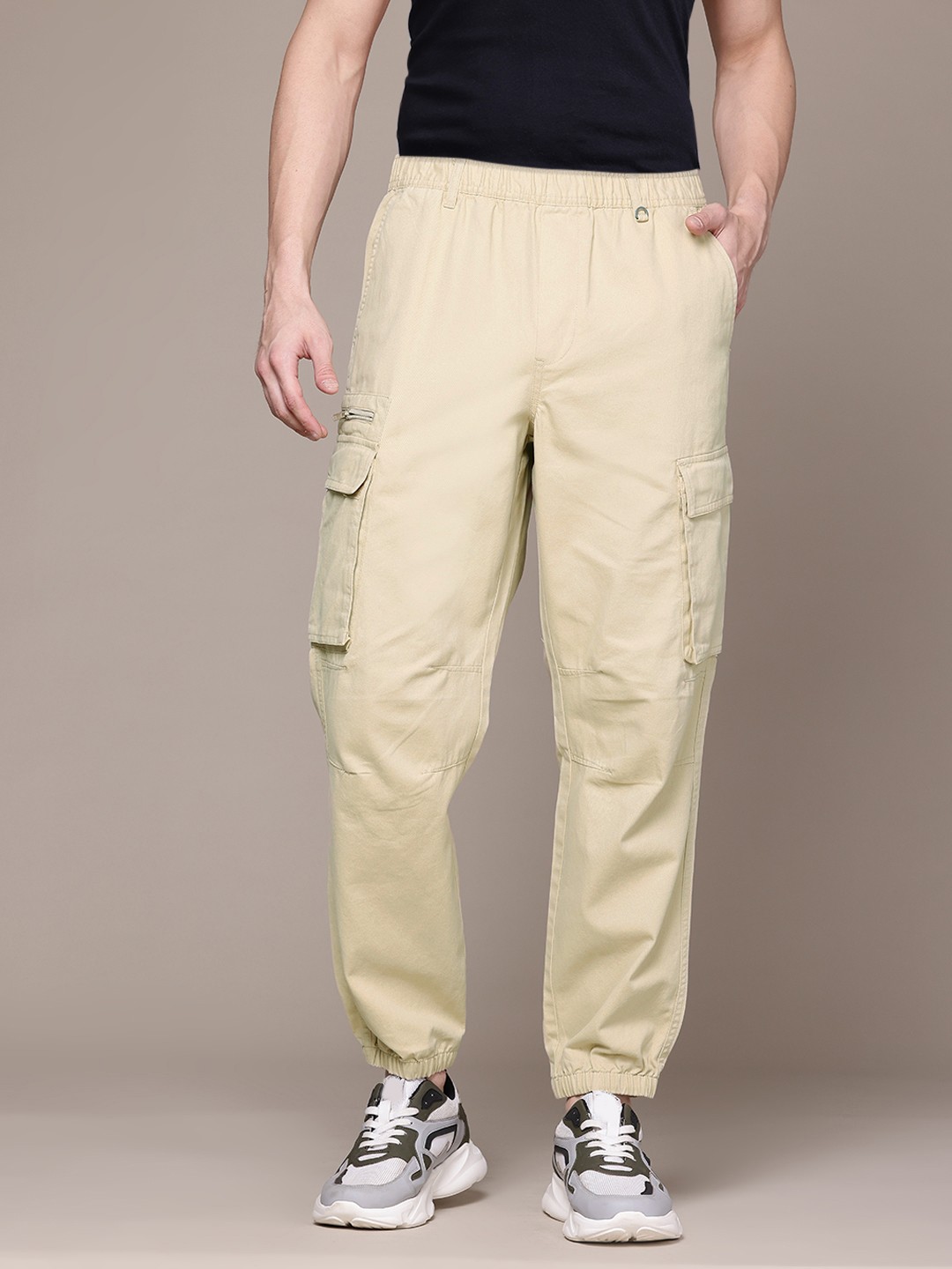 

The Roadster Lifestyle Co. Men Loose Fit Pure Cotton Jogger-Style Trousers with Zip Detail, Beige
