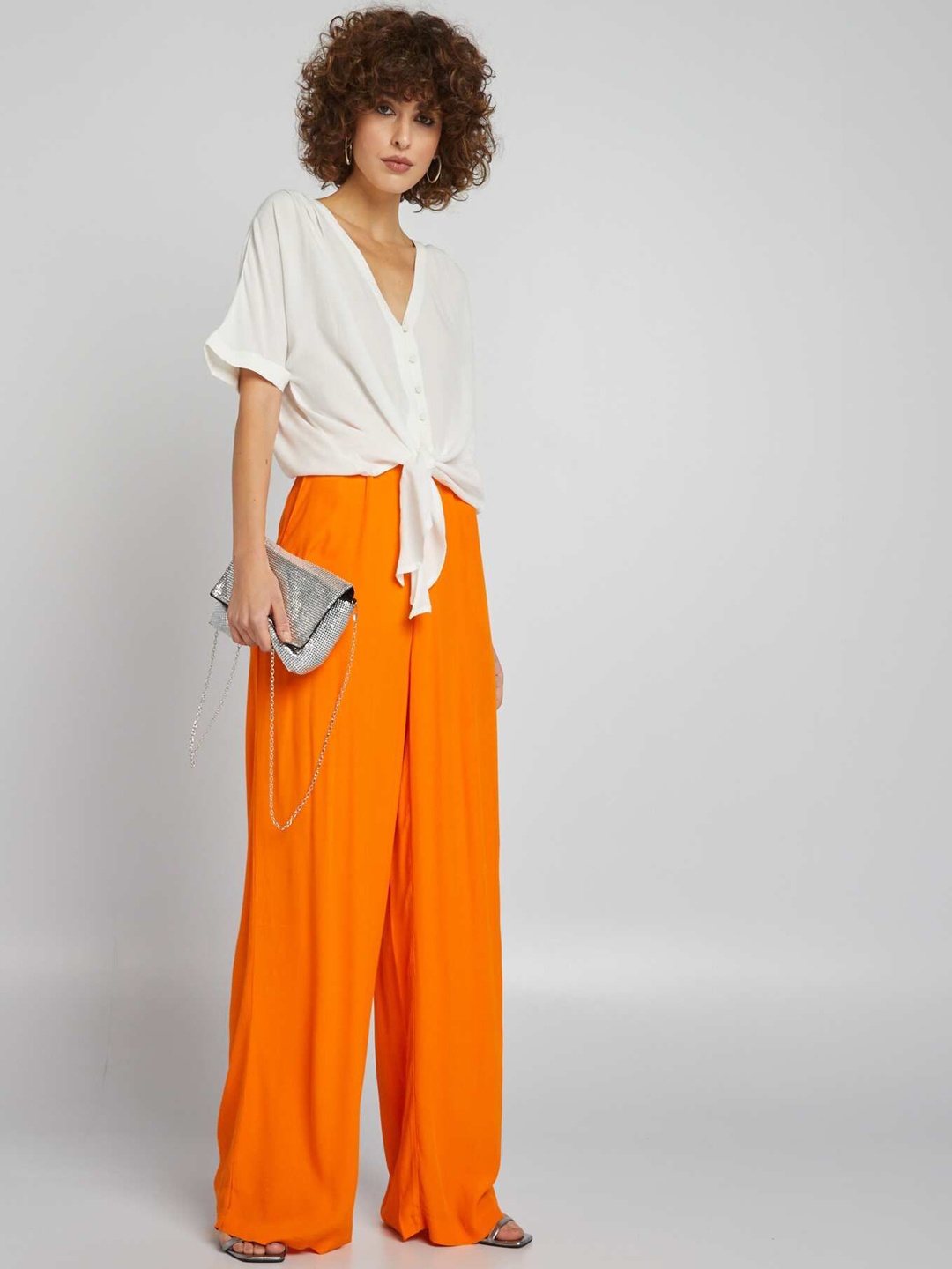 

KIABI Women Solid Loose Fit Mid-Rise Regular Trousers, Orange