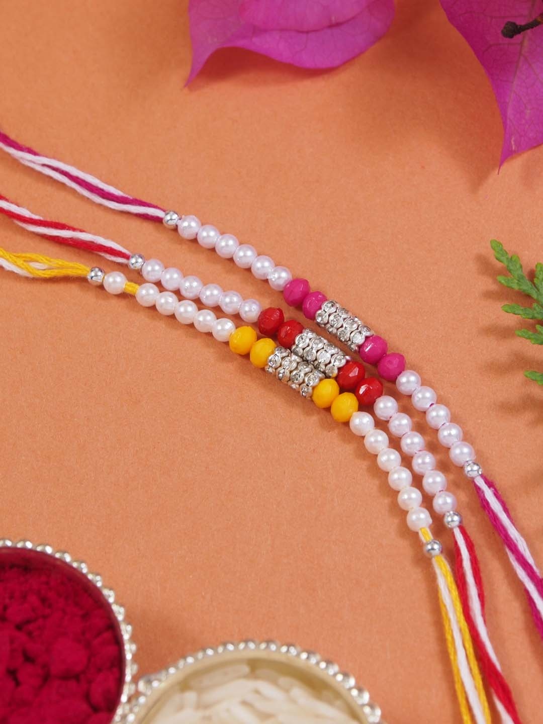 

I Jewels Set Of 3 Pearls Thread Rakhis With Roli Chawal & Rakshabandhan Card, White