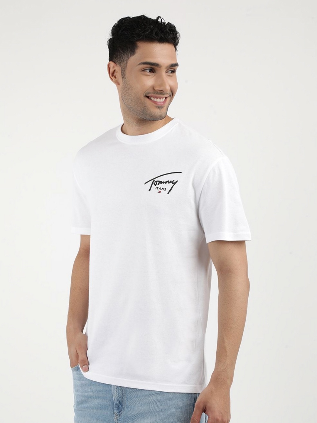 

Tommy Hilfiger Men Typography Printed Round Neck Regular Fit Applique T-shirt, White