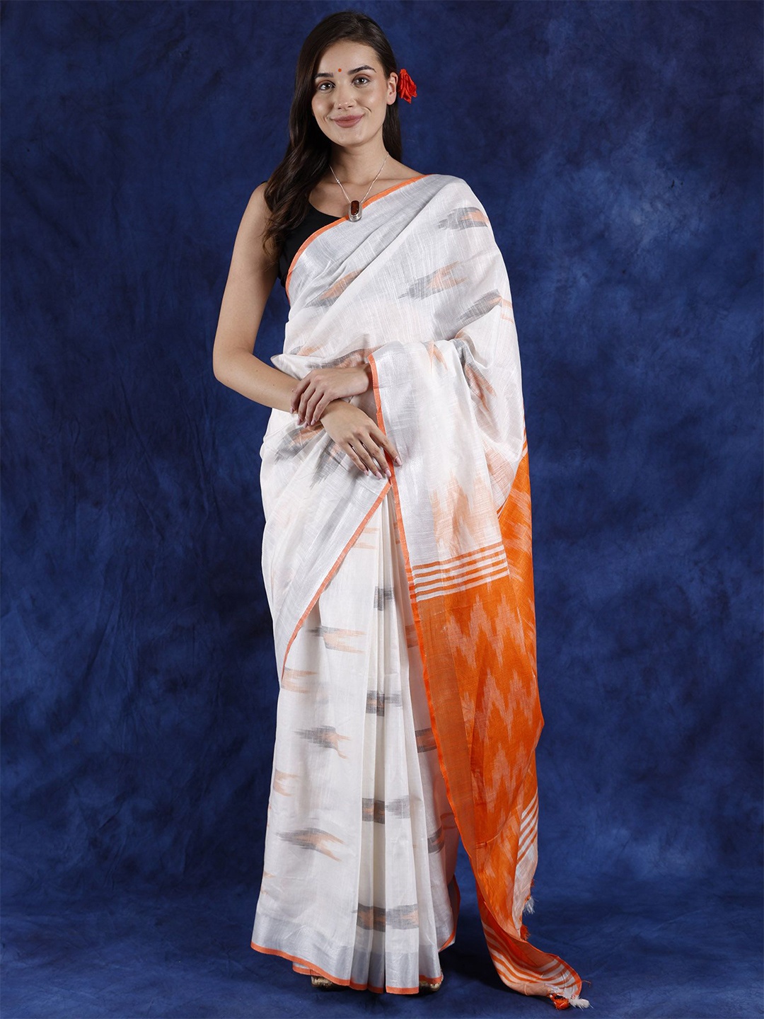 

Exotic India Zari Woven Pure Cotton Ikat Saree, White