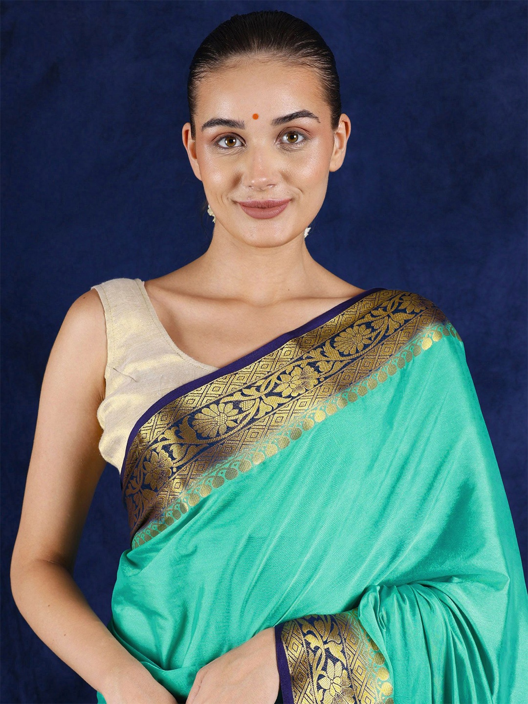 

Exotic India Florida Keys Plain Silk Saree with Zari Woven Floral Vine Border, Sea green
