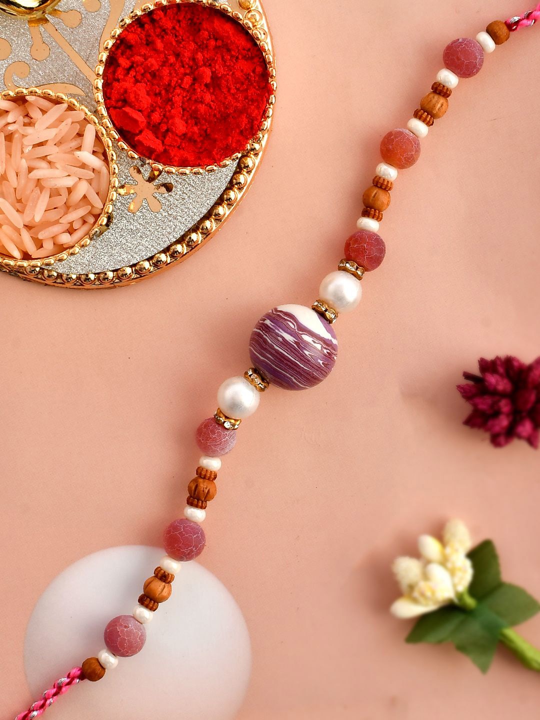 

Anouk Brown Sapphire & Embellished Beaded Thread Rakhi With Roli Chawal & Greeting Card, Purple