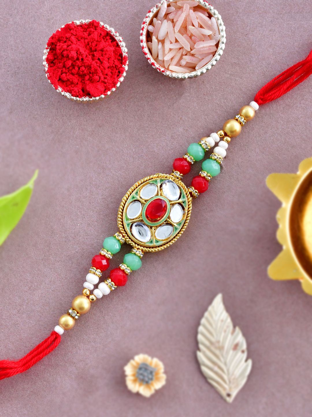 

Anouk Gold-Toned Kundan-Studded & Beaded Rakhi With Roli Chawal & Greeting Card, Red