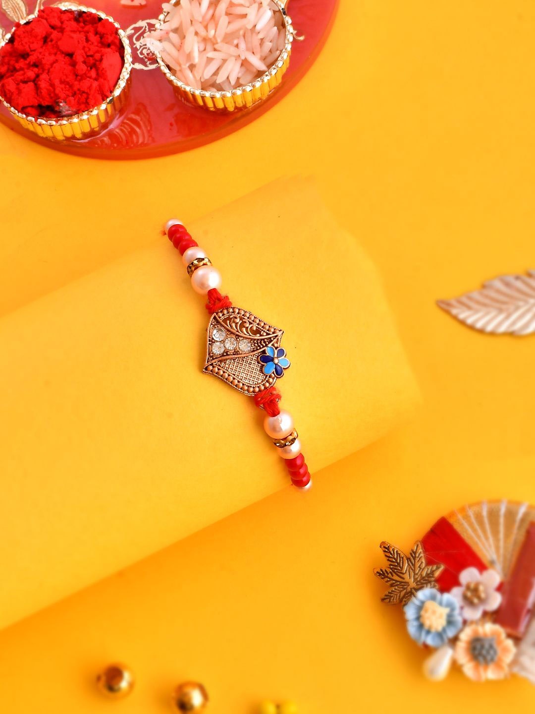 

Anouk Gold-Toned Stone-Studded & Beaded Rakhi With Roli Chawal & Greeting Card