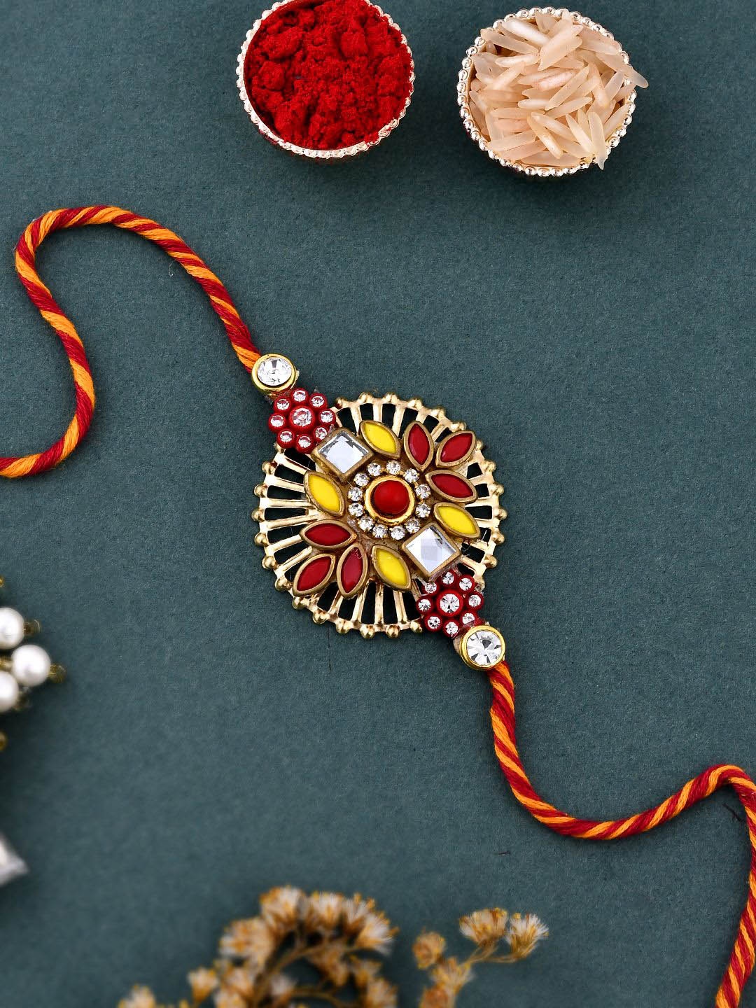 

Anouk Red Kundan Studded Cutwork Thread Rakhi With Roli Chawal