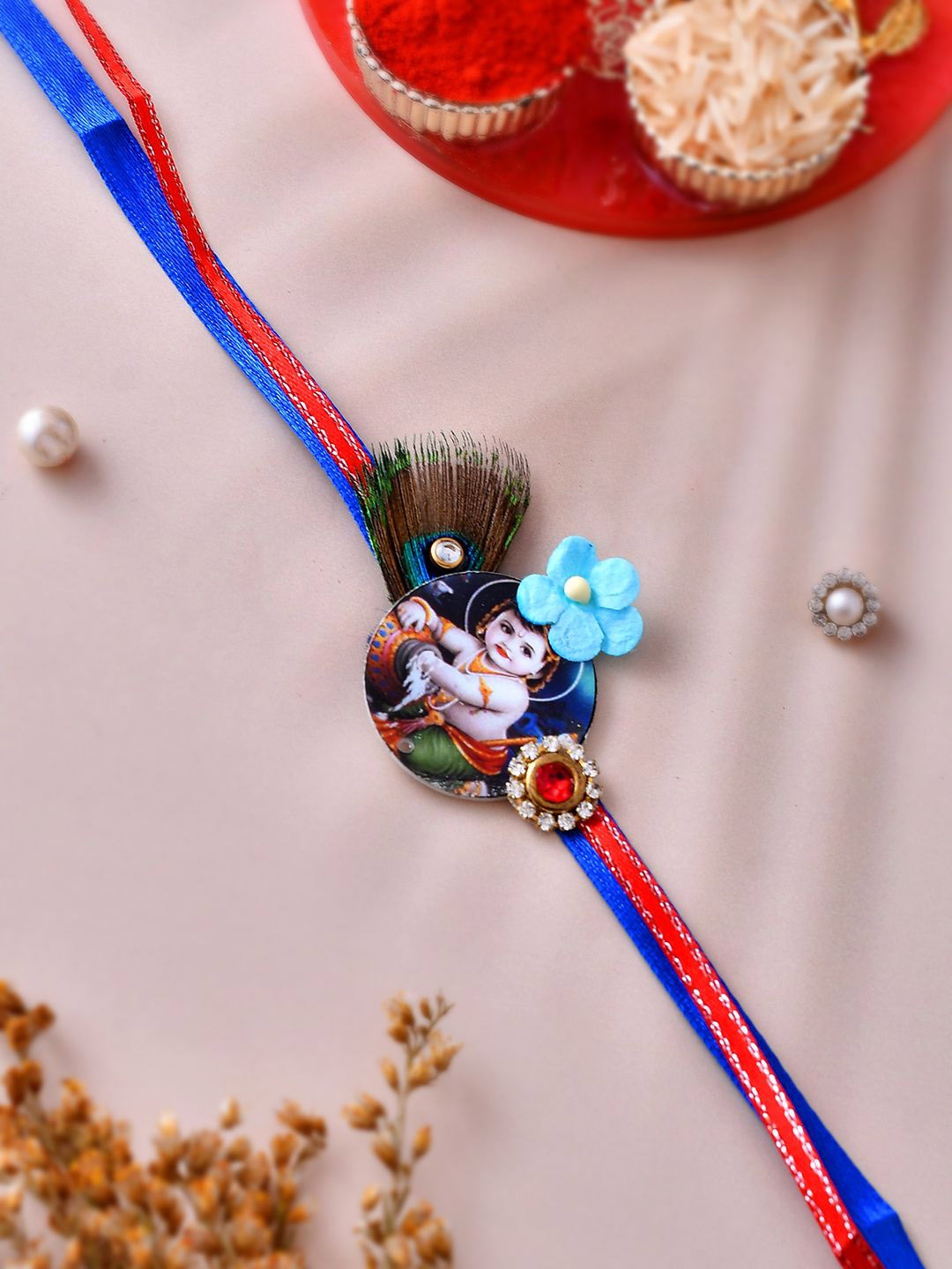 

Anouk Blue Mor Pankh & Bal Gopal Beaded Rakhi With Roli Chawal & Greeting Card