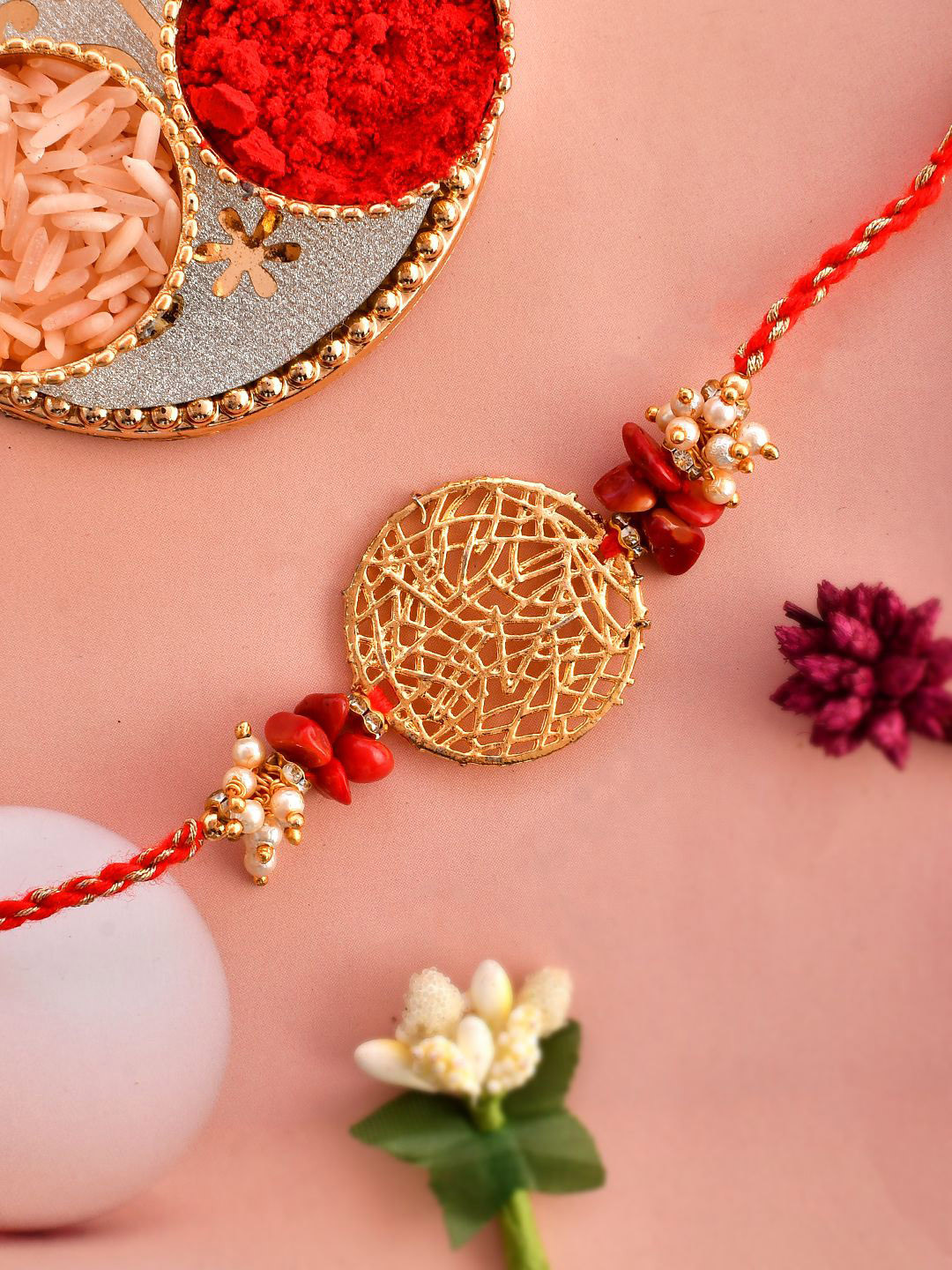 

Anouk Gold-Toned Pearl-Beaded Rakhi With Roli Chawal & Greeting Card