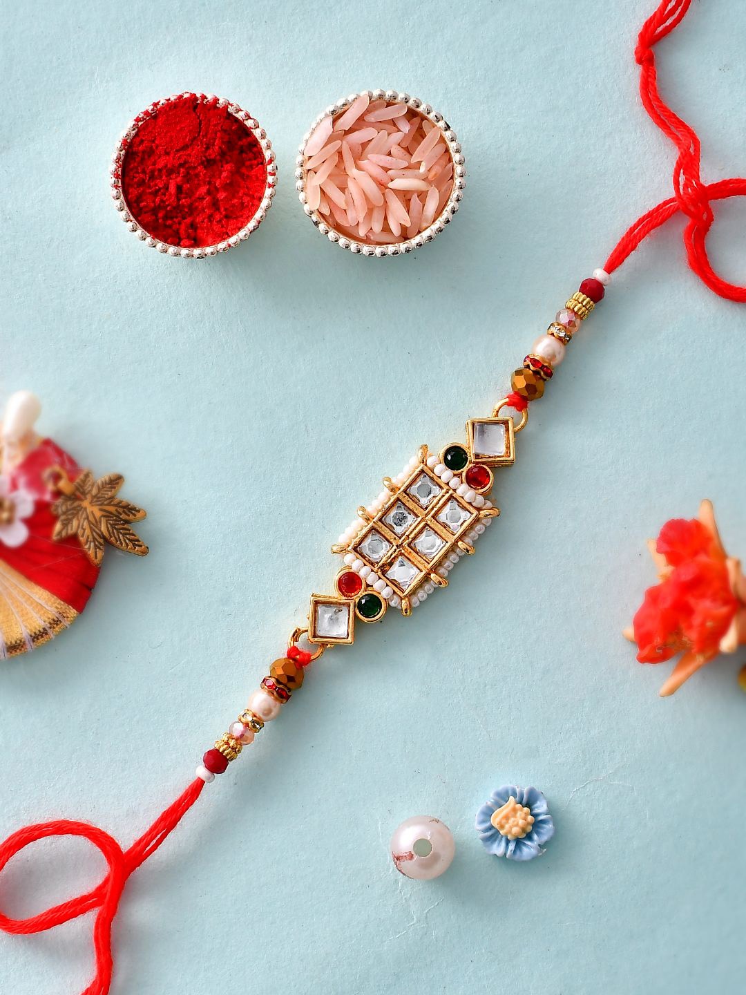 

Anouk Red Mirror & Pearl-Beaded Rakhi With Roli Chawal & Greeting Card