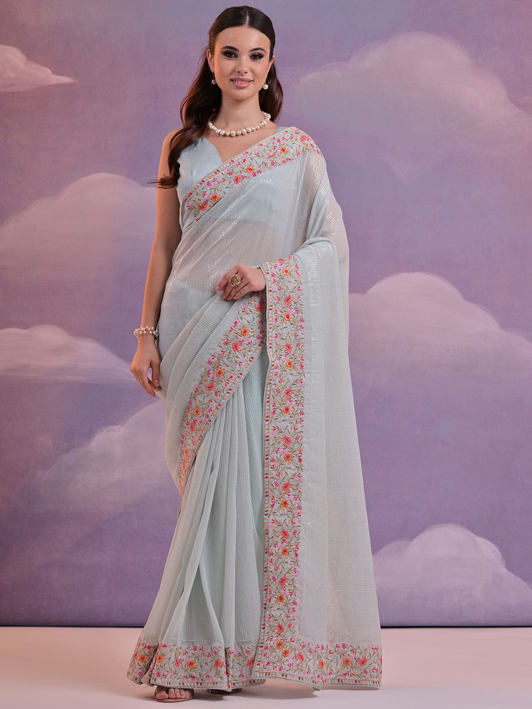 

Ishin Striped Sequinned Pure Georgette Saree, Blue