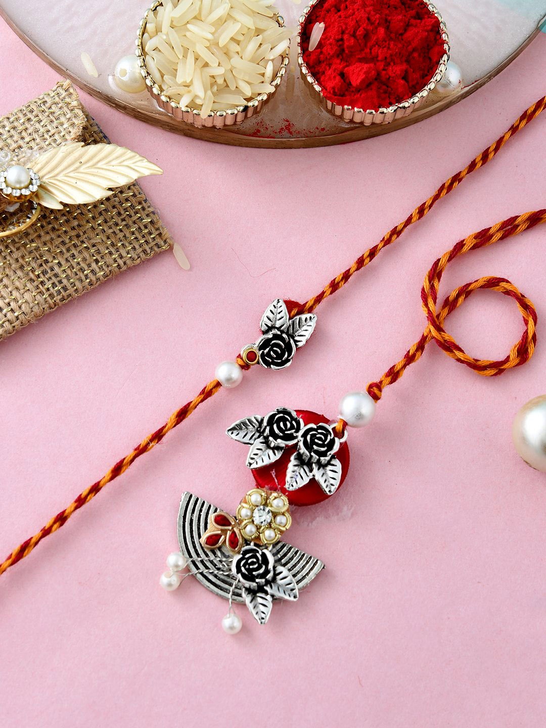 

Anouk Silver-Toned Beaded Bhaiya Bhabhi Rakhi With Roli Chawal & Greeting Card