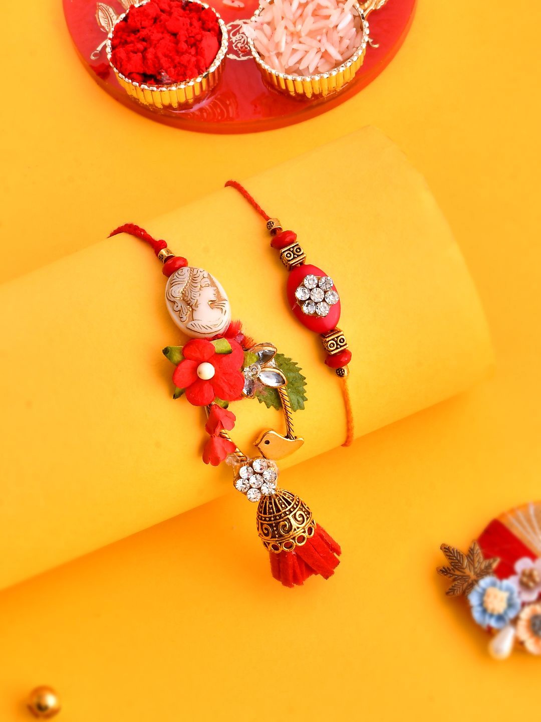 

Anouk Red Beaded Bhaiya Bhabhi Rakhi With Roli Chawal & Greeting Card