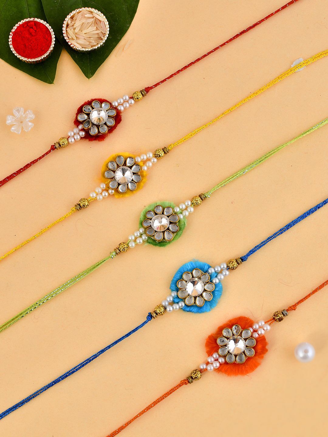 

Anouk Green Set Of 5 Kundan & Pearl Beaded Thread Rakhis With Roli Chawal & Greeting Card, Gold