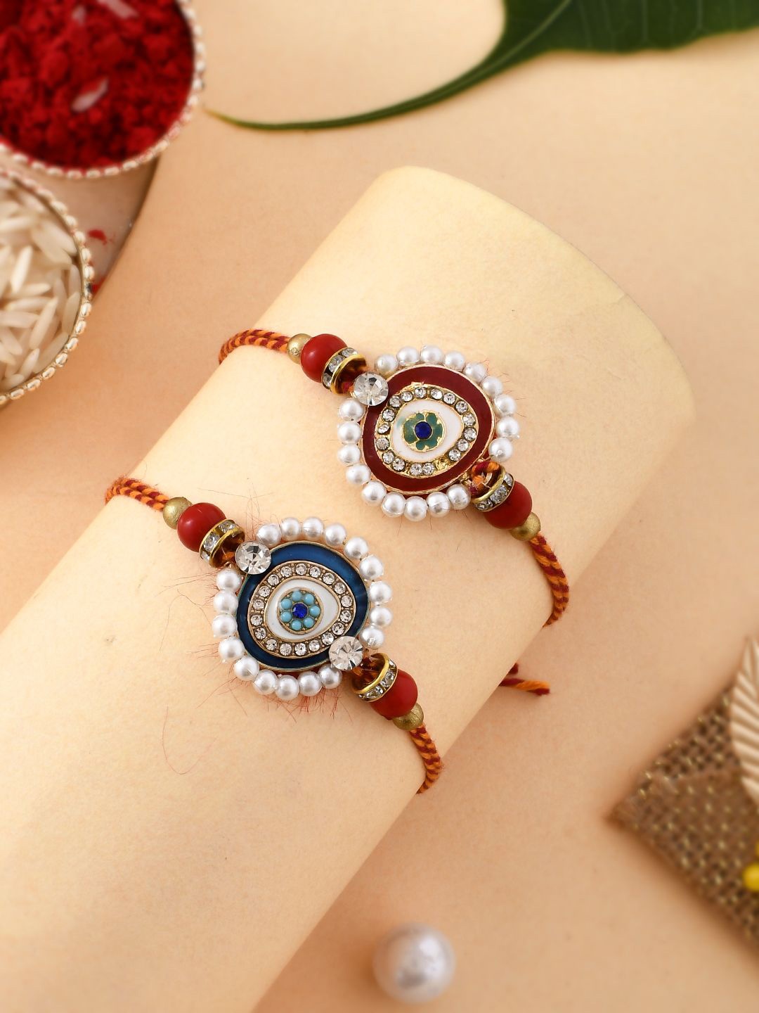 

Anouk Set Of 2 White Pearl-Beaded Rakhi With Roli Rice & Greeting Card