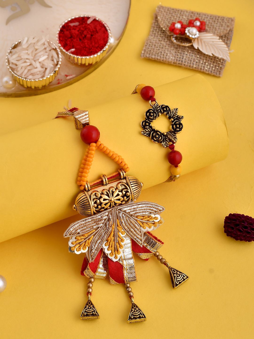 

Anouk Orange Beaded Bhaiya Bhabhi Rakhis With Roli Chawal & Greeting Card