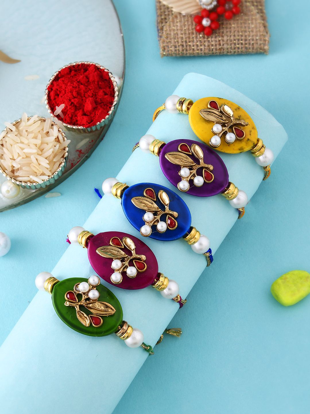

Anouk Set Of 5 Gold-Toned Beaded Rakhi With Roli Rice & Greeting Card