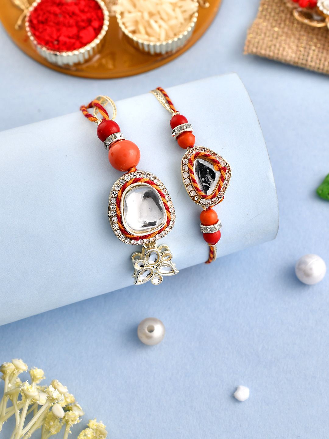 

Anouk Red Stone Studded & Beaded Bhaiya Bhabhi Rakhis With Roli Chawal & Greeting Card, Orange