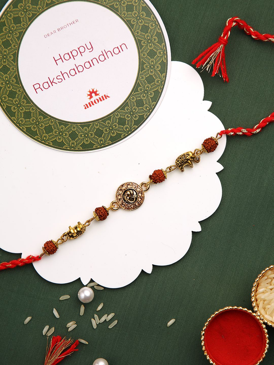 

Anouk Stones Studded & Rudhraksh Beaded Rakhi With Roli Chawal & Greeting Card, Gold