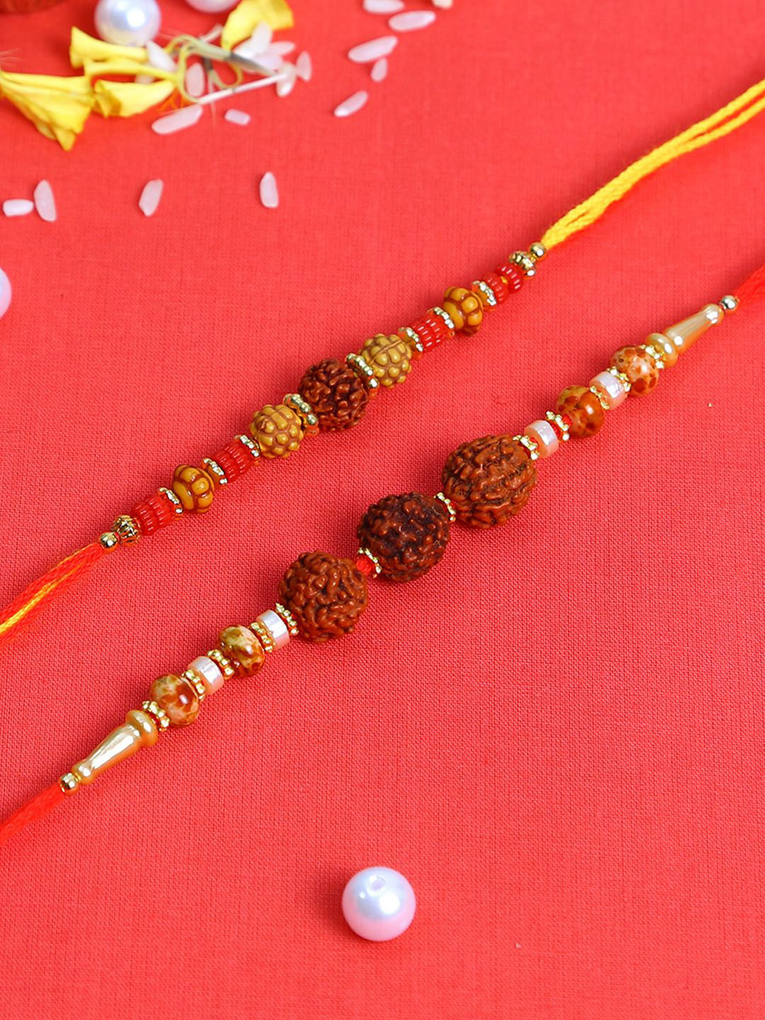 

Anouk Set Of 2 Brown Rudaraksh-Beaded Rakhi With Roli Rice & Greeting Card