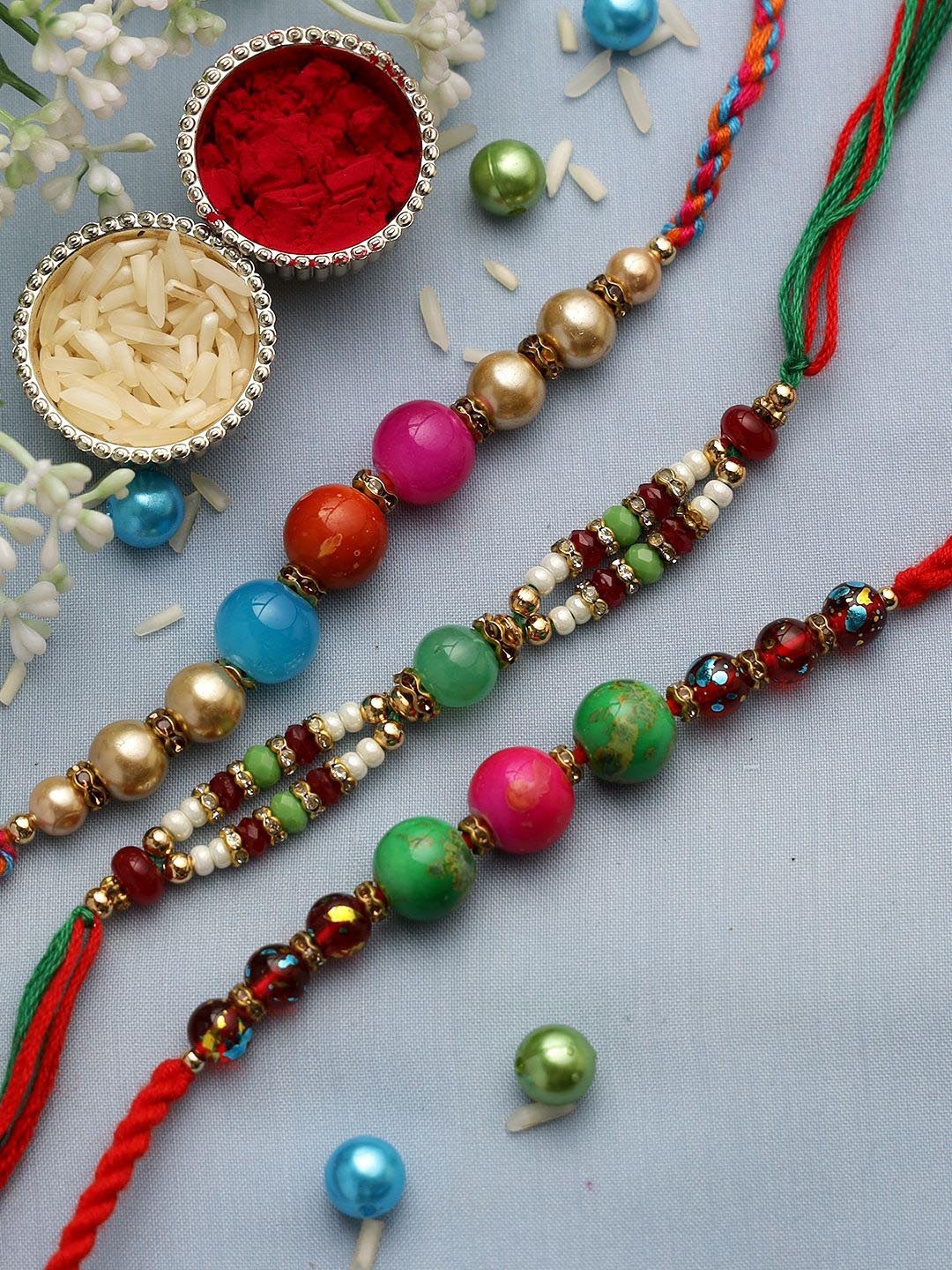 

Anouk Red Set Of 3 Stone Studded & Beaded Thread Rakhi With Roli Chawal & Greeting Card, Gold