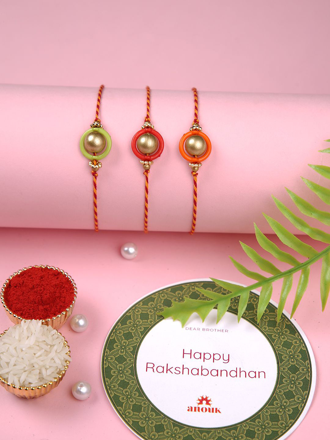 

Anouk Gold Toned Set Of 3 Beaded Thread Rakhis With Roli Chawal & Greeting Card, Green