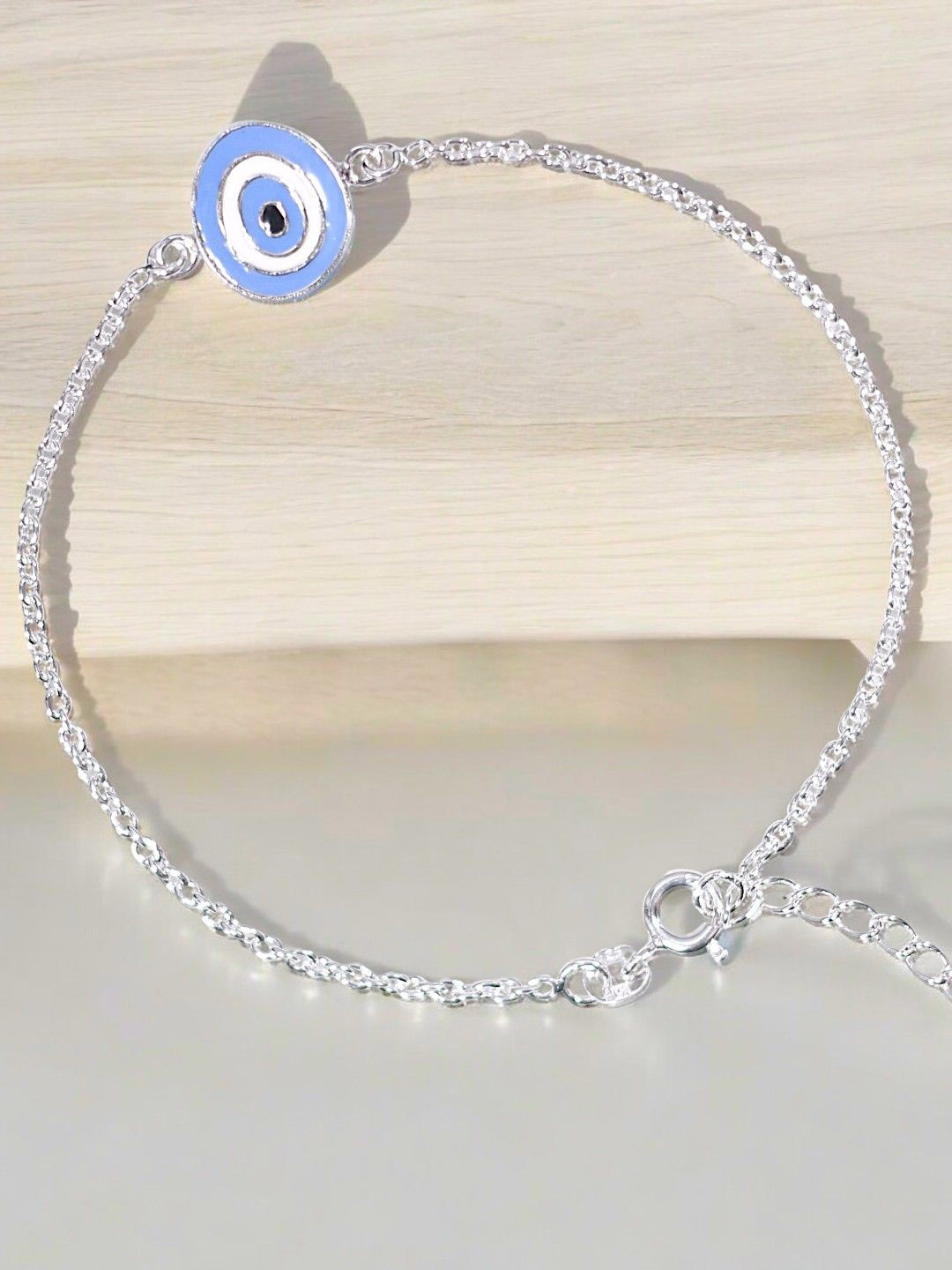 

Taraash 925 Sterling Silver Eye Motif Bracelet Rakhi With Roli Chawal