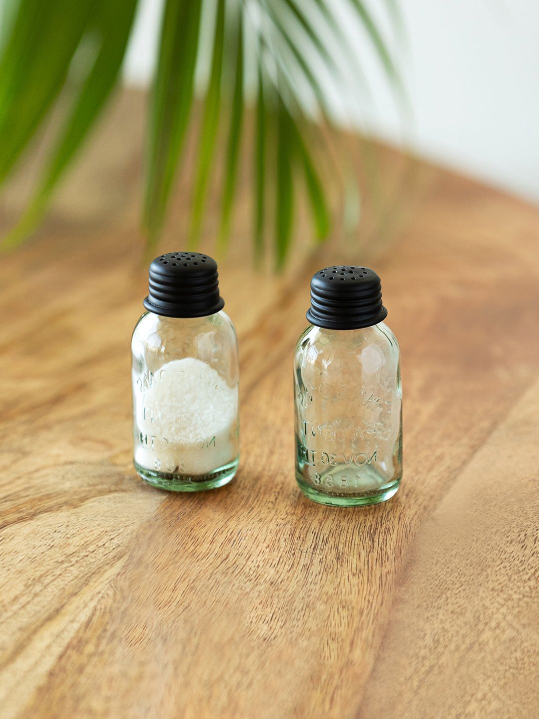 

ExclusiveLane Black & Transparent 2 Pieces Glass Salt and Pepper Shakers