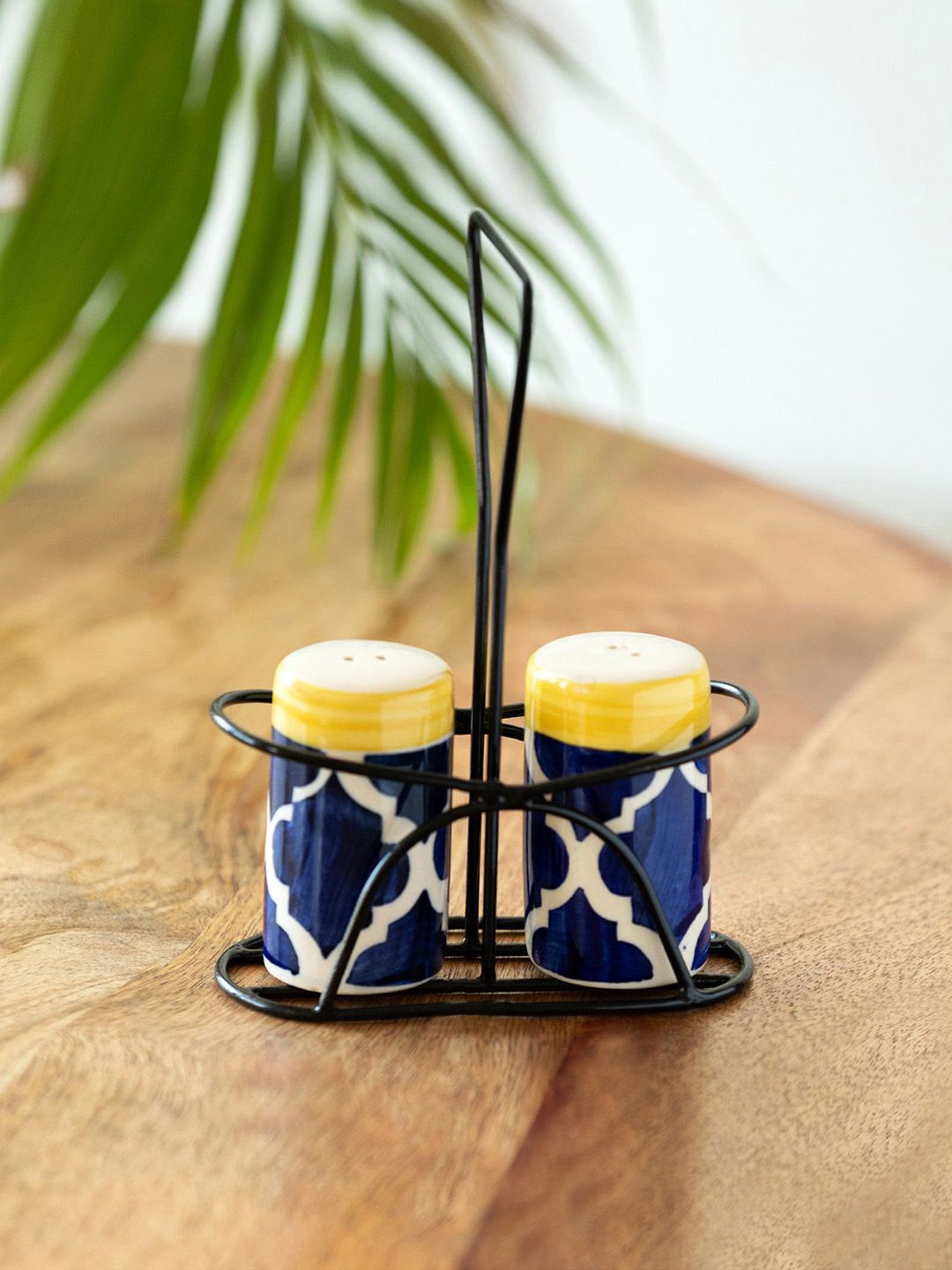 

ExclusiveLane Blue & White 2 Pieces Moroccan Salt & Pepper Shaker With Iron Holder-70ml