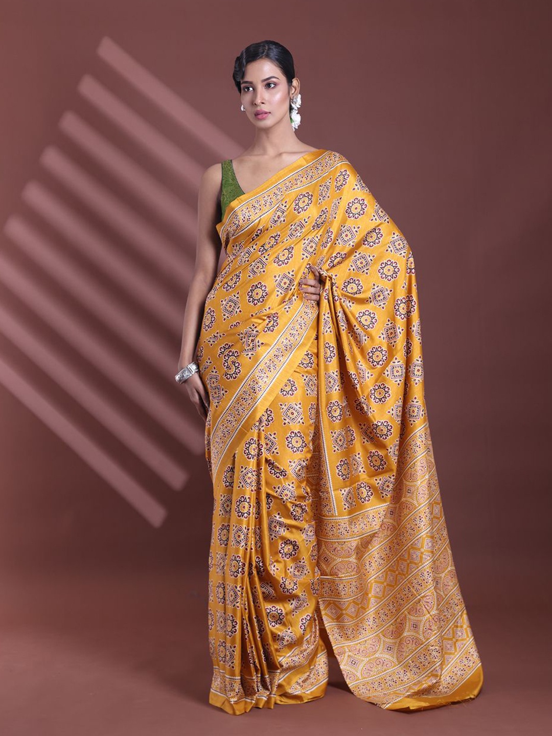 

Charukriti Ethnic Motifs Printed Saree With Blouse Piece, Mustard
