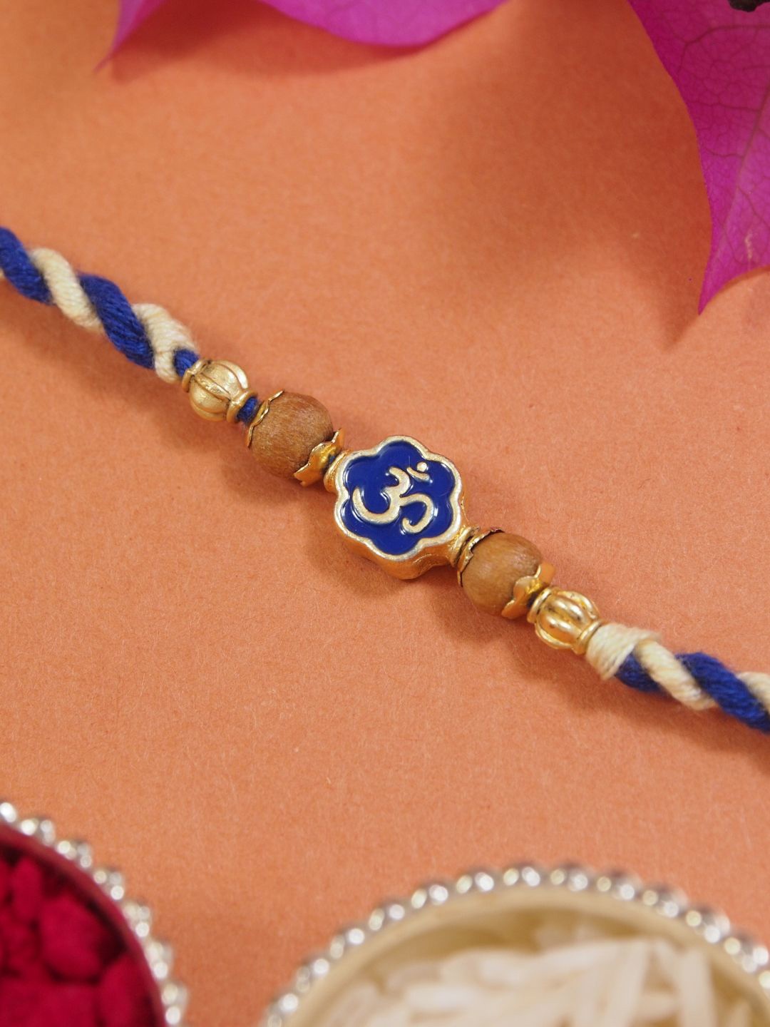 

I Jewels OM Thread Rakhi With Roli Chawal & Rakshabandhan Card, Blue