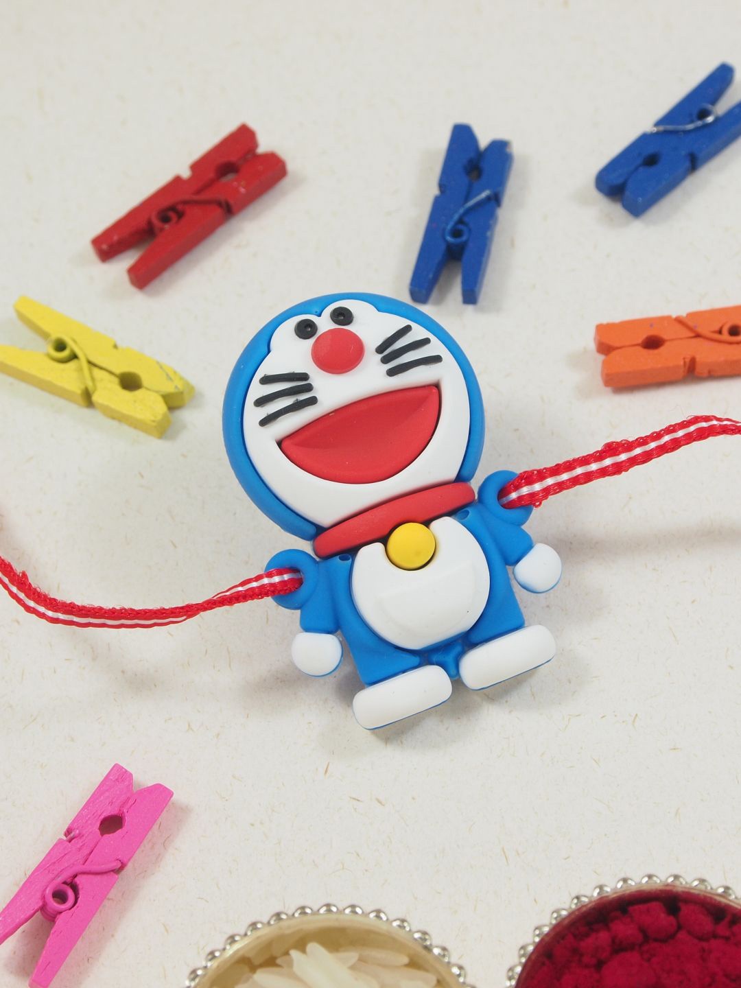 

I Jewels Kids Doremon Thread Rakhi With Roli Chawal & Rakshabandhan Card, Red
