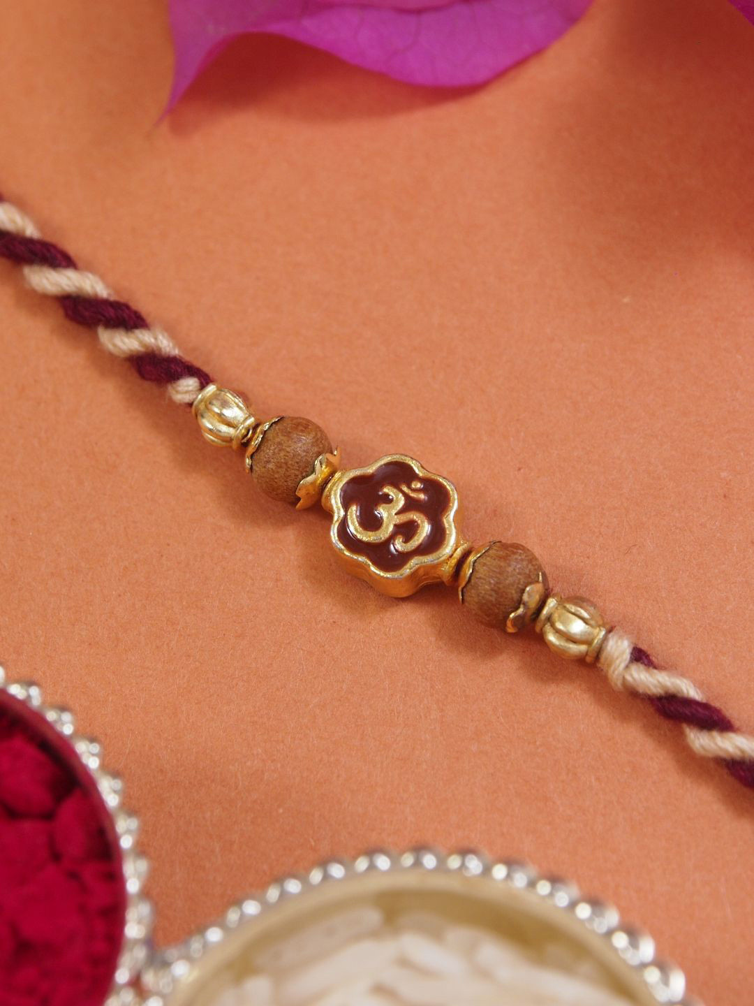 

I Jewels OM Thread Rakhi With Roli Chawal & Rakshabandhan Card, Maroon