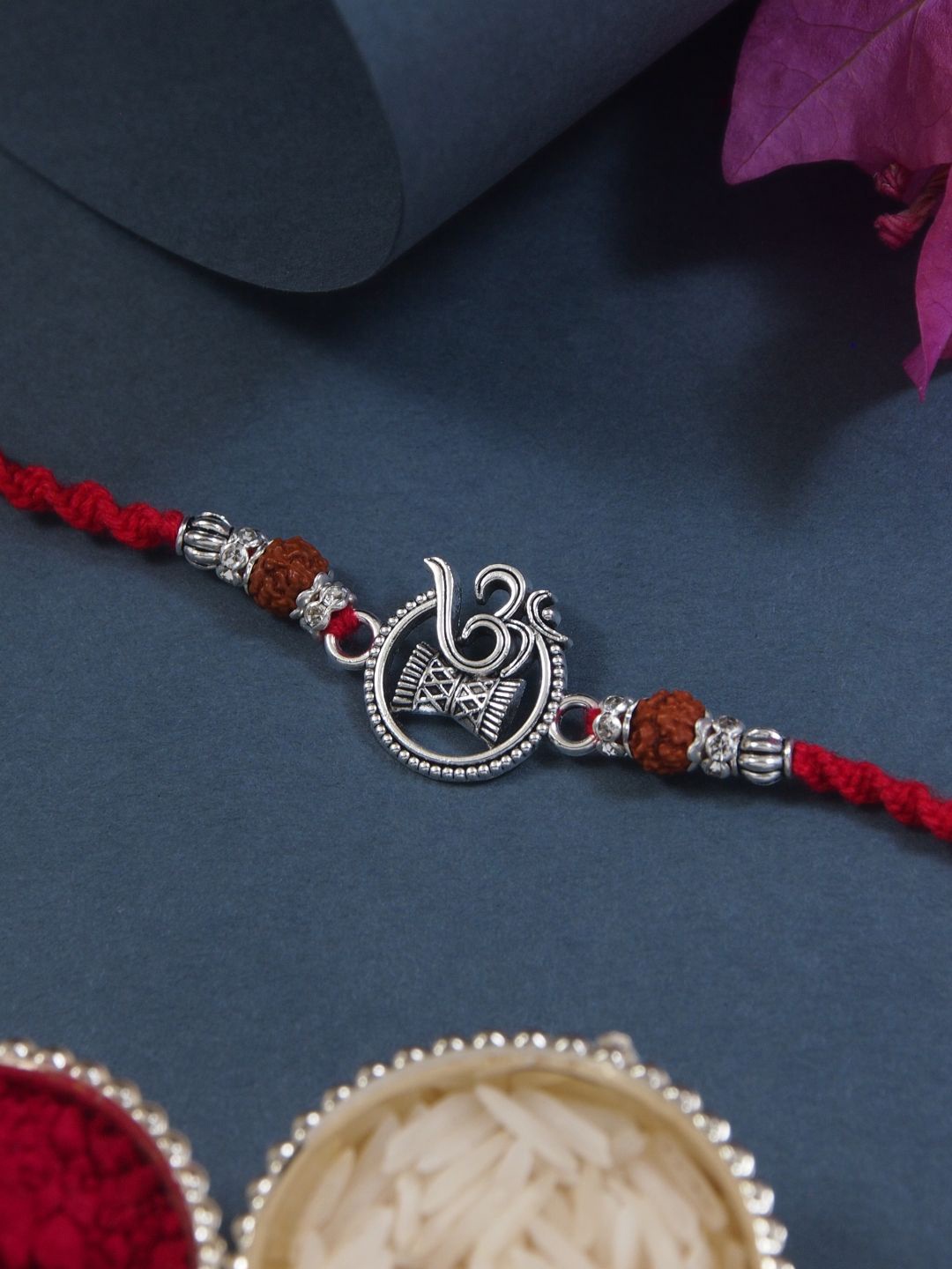 

I Jewels OM Thread Rakhi With Roli Chawal & Rakshabandhan Card, Red