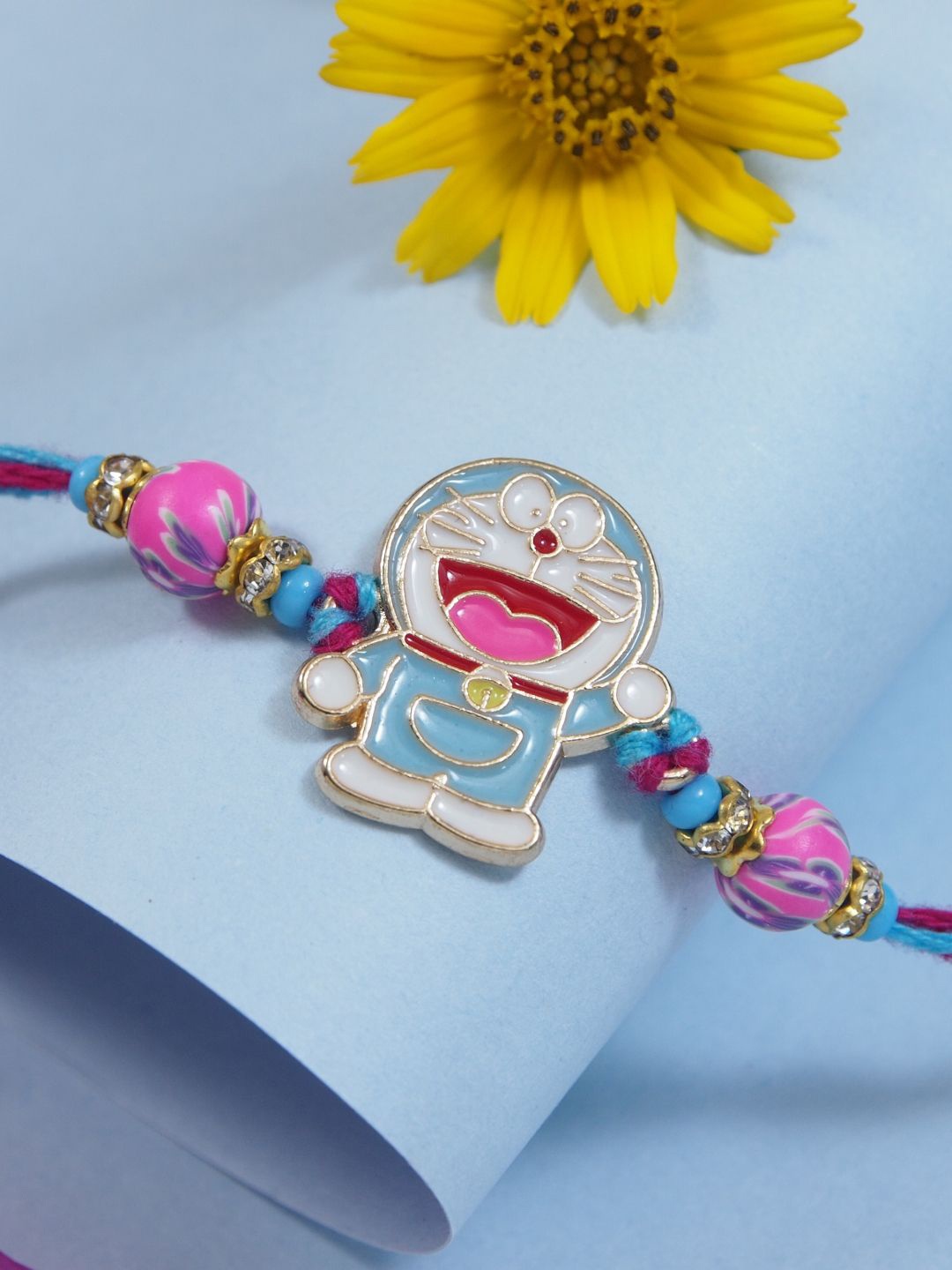 

I Jewels Boys Doraemon Thread Rakhi With Roli Chawal & Greeting Card, White