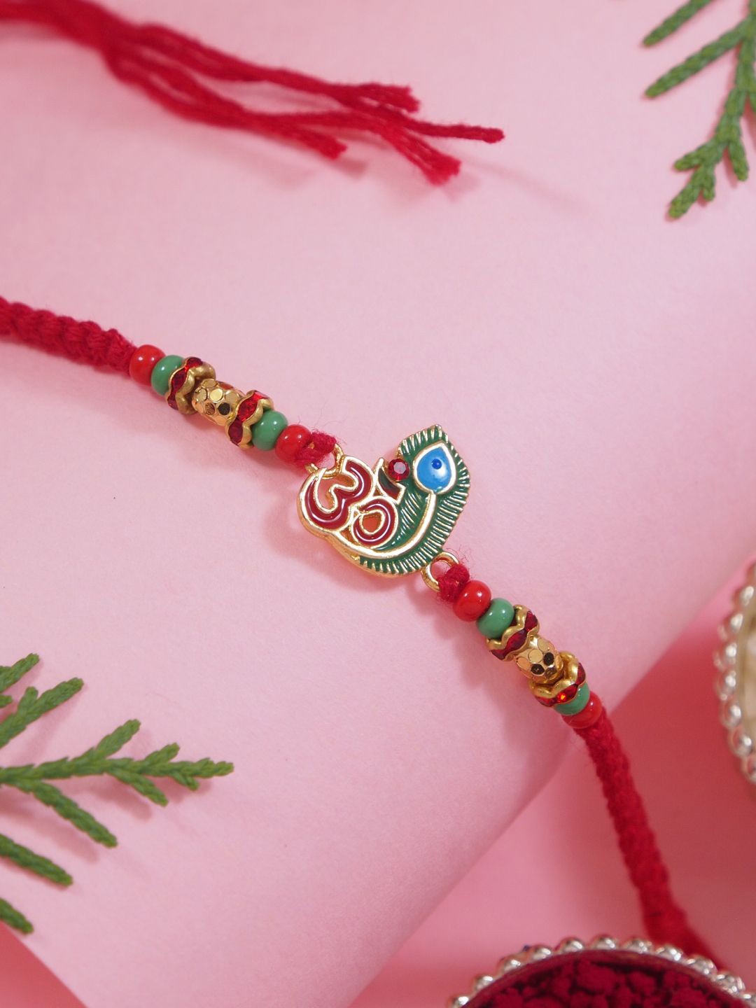 

I Jewels Om Thread Rakhi With Roli Chawal & Greeting Card, Red